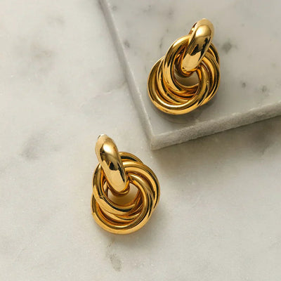 Boucles d'oreilles entrelacées | Or blanc